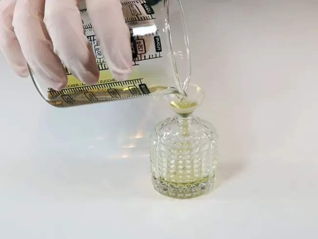 A picture of someone making their own perfume. Ethanol is often used as a fragrance carrier for home-made perfumes.